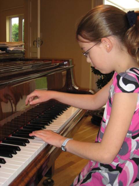 Girl at piano lesson in Pinner